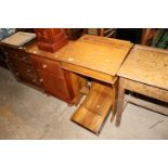 A vintage child's school desk; and a folding tray
