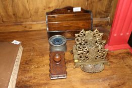 A wooden letter rack; a brass similar; a blotter a