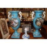 A large pair of continental blue glazed urns decor