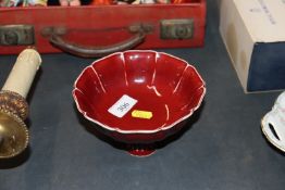 An Oriental red glazed stem cup