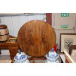 A Victorian rosewood snap top supper table