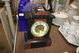 A black slate and rouge marble single hole mantel