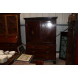 A 19th Century inlaid mahogany linen press, fitted