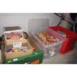 Three boxes containing wooden model railway toys;