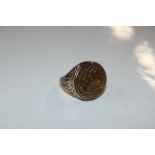 A 9ct gold ring with 1982 half Sovereign, approx.