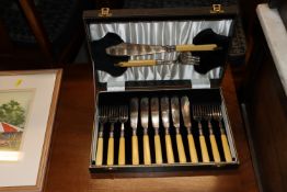 A cased set of six each plated fish knives and for