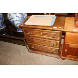 An oak three drawer chest