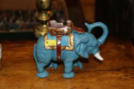 A novelty cast iron elephant money box