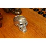 A metal skull with moving jaw