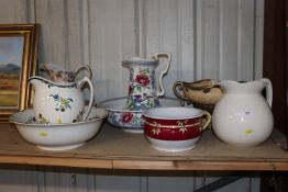 A collection of various toilet jugs and bowls, jar