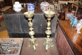 A pair of antique French brass candlesticks