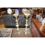 A pair of antique French brass candlesticks