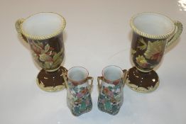 A pair of CIC china mugs with floral decoration; a