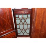 A George III inlaid mahogany hanging corner cupboa