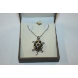 A Sterling silver and amber articulated turtle nec