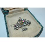 An antique Sterling silver basket of flowers brooc