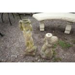 A pair of outdoor garden ornaments in the form of