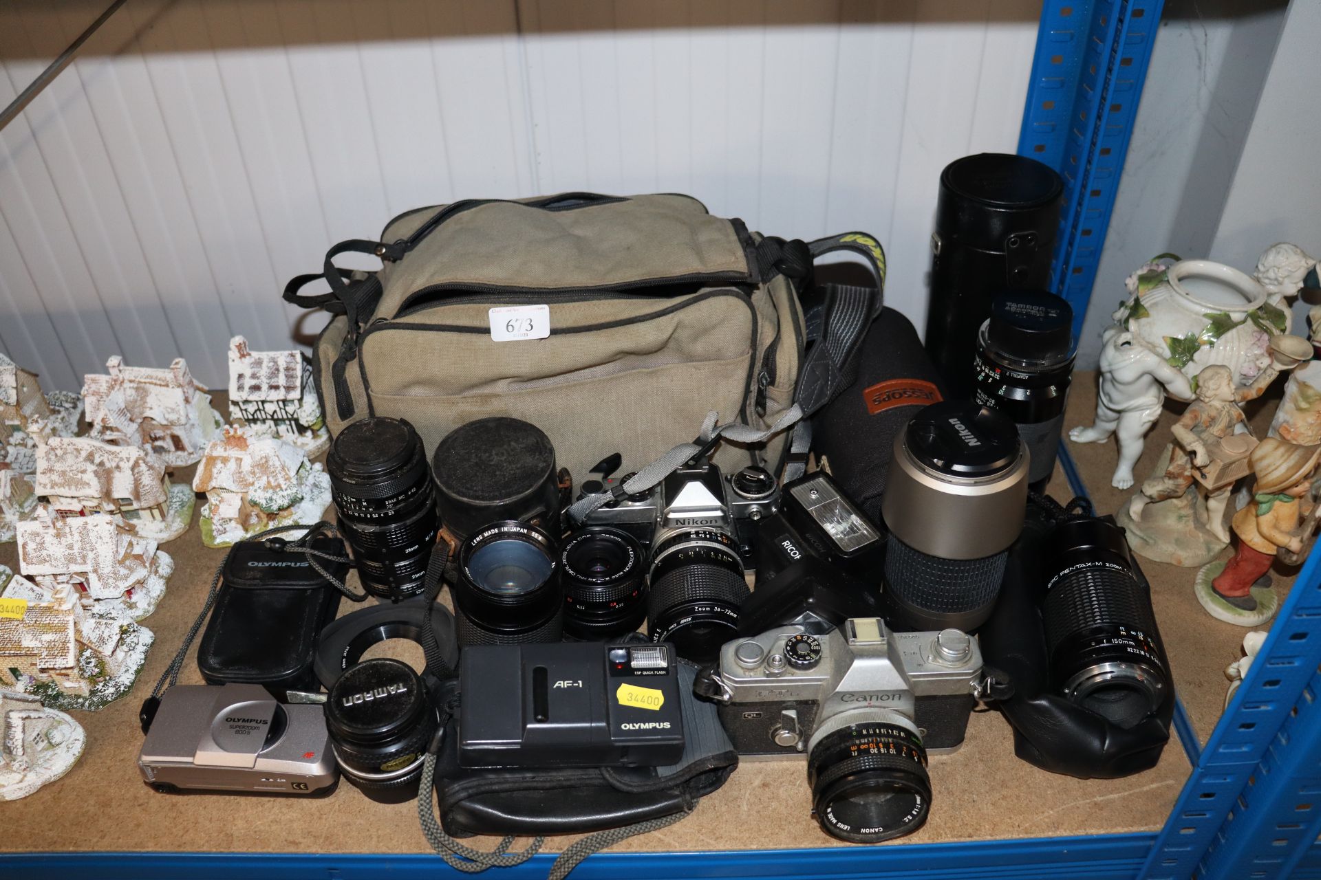 A Canon FT camera; Nikon camera; various other cam