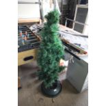 An artificial Christmas tree and stand