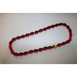 A cherry amber coloured necklace