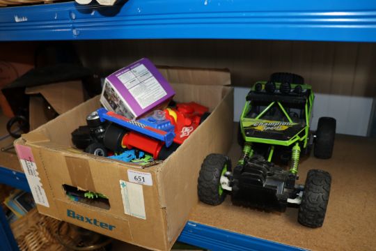 A box of toys and a radio control buggy