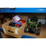 A box of toys and a radio control buggy