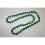 A jade coloured bead necklace