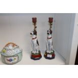 A pair of bronze and porcelain candlesticks in the