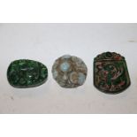 Three jade coloured pendants