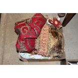 A box containing miscellaneous fabric and vintage braid