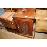 An Edwardian pot cupboard with carved panel door