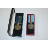 A Royal Highlander 50th Anniversary medal in case