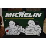 A reproduction Michelin advertising sign