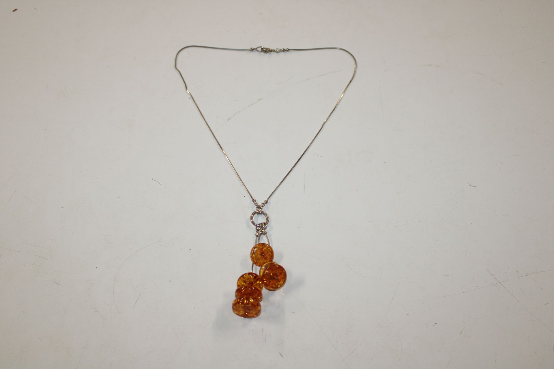 A silver and amber necklace
