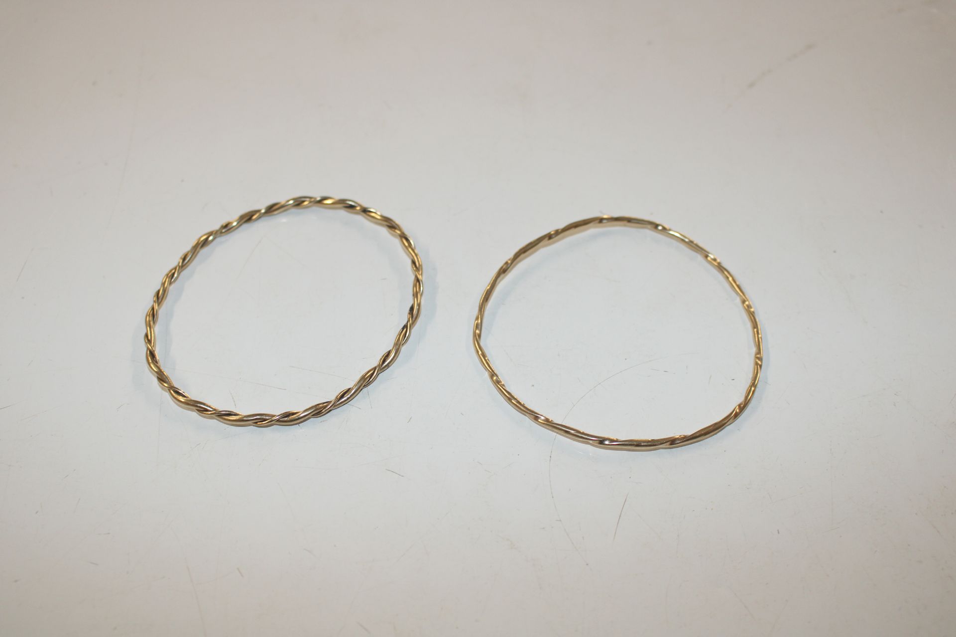 A near pair of 9ct gold bangles, total weight appr