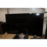 A Samsung flat screen curved television - lacking