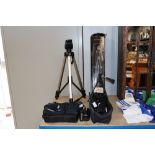 Two camera tripods and an Optus spotting scope, a