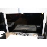 A Panasonic flat screen television and remote cont