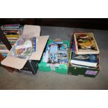 Three boxes containing various books, football pro