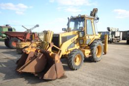 Caterpillar 428 4WD backhoe loader. Registration xx. 9,819 hours. 16.9-28 rear wheels and tyres @