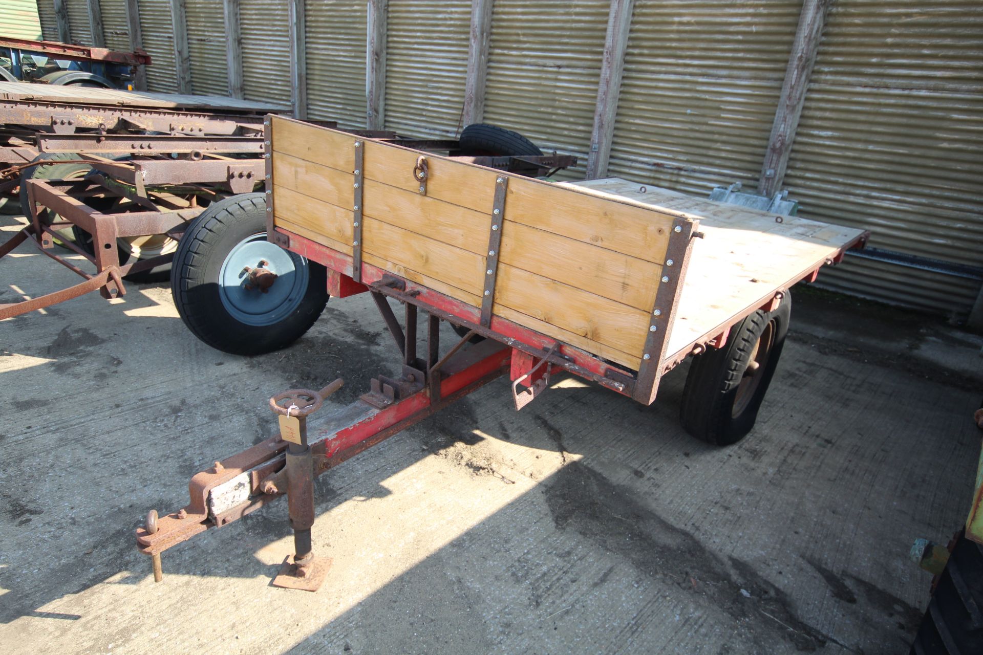 Single axle wooden chassis tipping trailer.