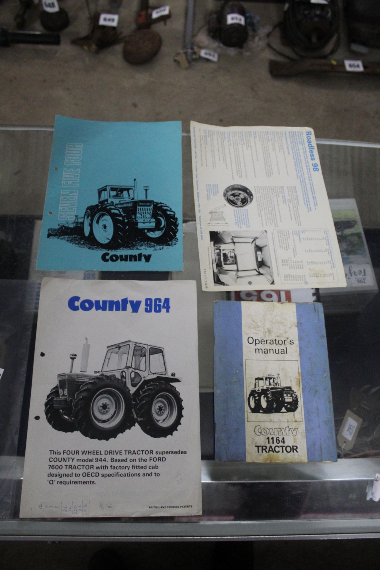 County 964 brochure and County 1164 operators manu