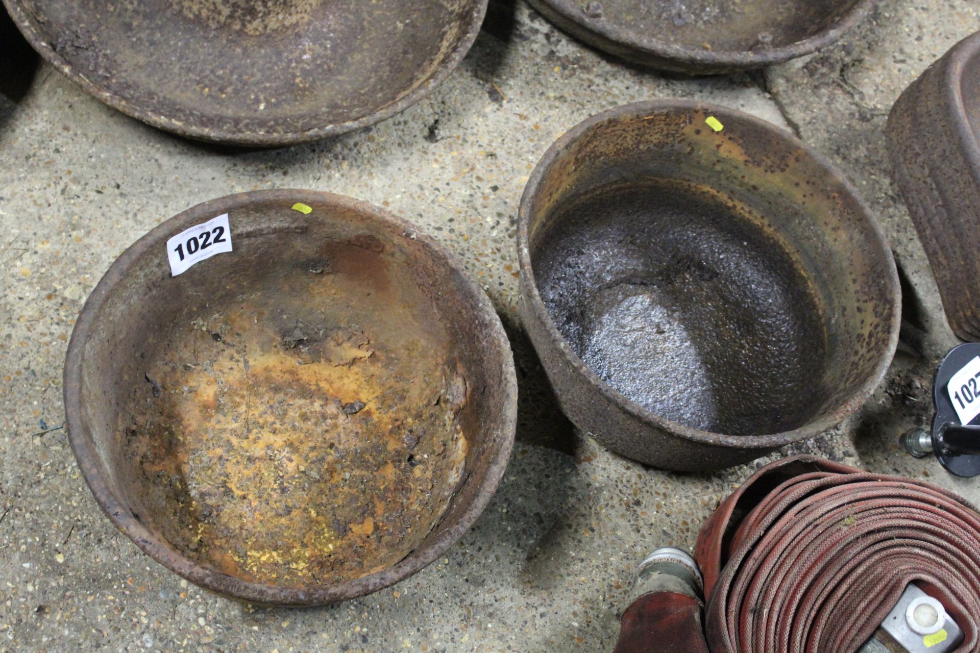 2x cast iron feed bowls.