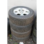 4x Nissan wheels with 255/65R17 tyres.