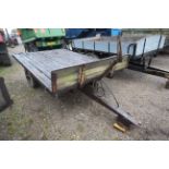 Massey Ferguson 717 3T flat bed tipping trailer. With 12-stud axle. Badged. Serial number S11091.
