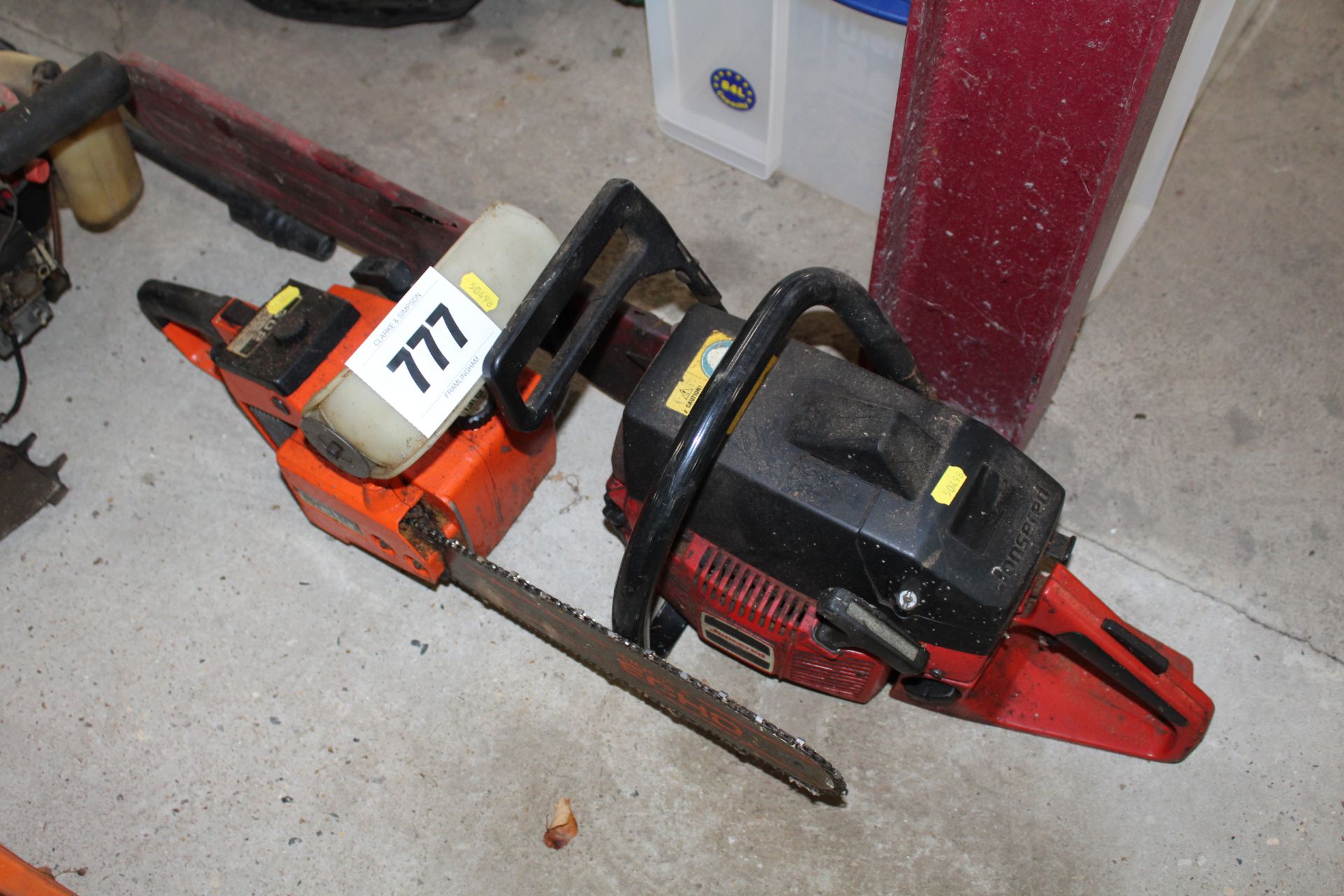 Echo 302 chainsaw and a Jonsered chainsaw.