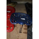 Ransomes cast iron implement seat.