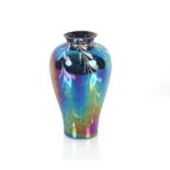 A lustre amethyst glass baluster vase with white l