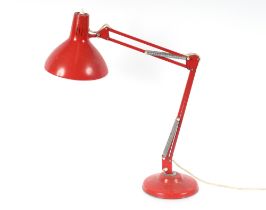 A 1001 Lamps, red angle poise type table lamp