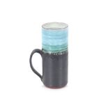 A Studio pottery mug, decorated blue, green and bl